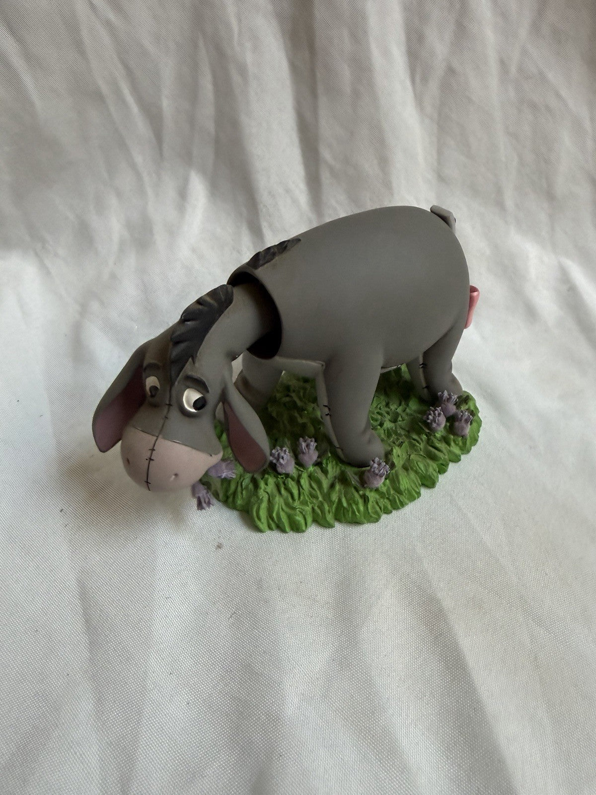Disney Collectible Vintage Eeyore Figurine Laying in the Grass Butterfly on Tail